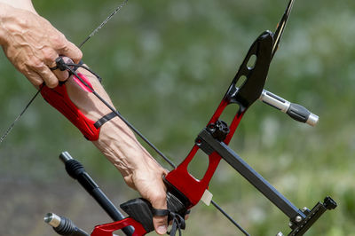 Cropped image of man playing archery