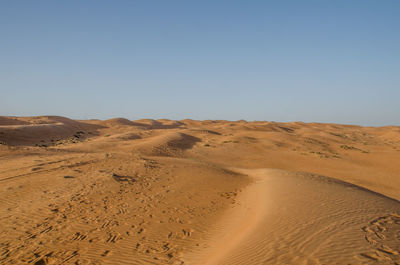 Scenic view of desert against clear sky