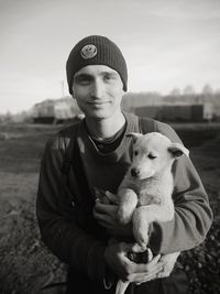 Portrait of smiling man with dog