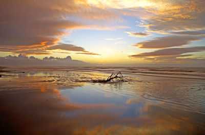 Scenic view of sea against dramatic sky