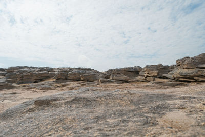 Rock formations on landscape against sky