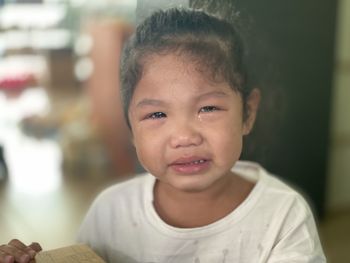 Close-up portrait of cute baby at home