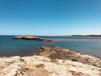 Scenic view of sea against clear sky