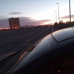 Cars on road at sunset