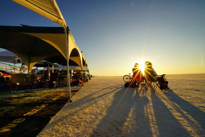 People on beach at sunset