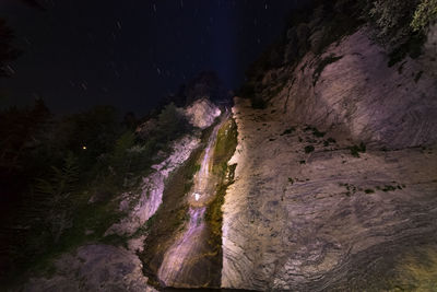 Scenic view of rock formations at night