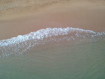 Close-up of waves rushing towards shore