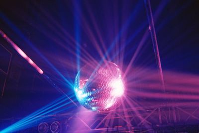 Low angle view of illuminated lighting equipment at night