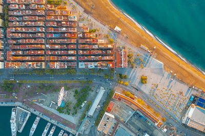 View of residential buildings on the oceanfront in barcelona spain. sea spit in blue water.