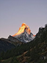 Scenic view of snowcapped mountains against clear sky