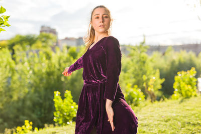 Young woman standing on field