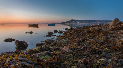 Scenic view of sea against sky during sunset