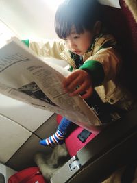 Midsection of woman holding hair