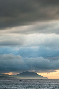 Scenic view of sea against cloudy sky