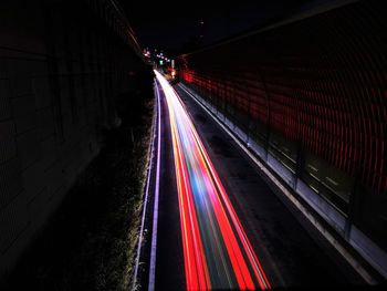 High angle view of light trails on road at night