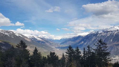 Scenic view of snowcapped mountains against sky