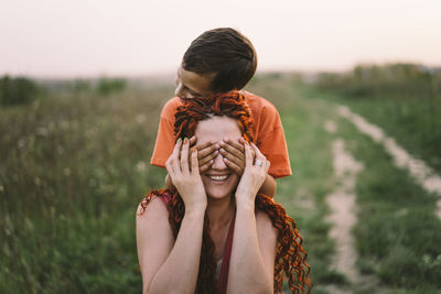 Happy mother having fun with her son outdoor. family and love concept.