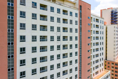 Low angle view of buildings in city against sky