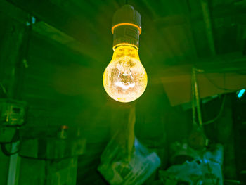 Low angle view of illuminated light bulb