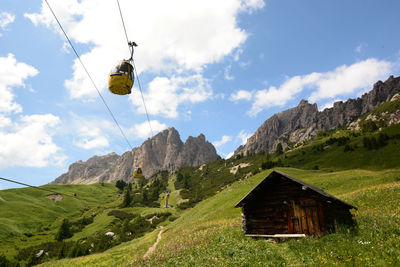 Low angle view of person paragliding against sky