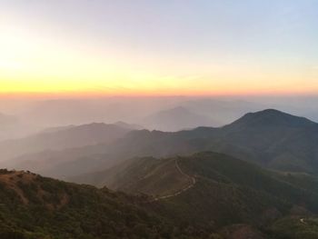 Scenic view of mountains against sky during sunset