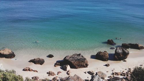 High angle view of rocks on beach against sky