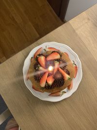 High angle view of fruits in plate on table