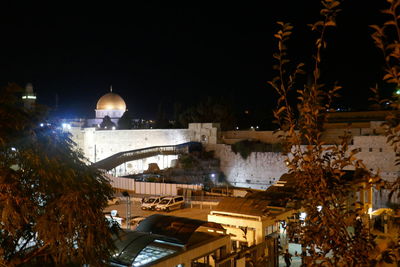 View of illuminated city at night during winter