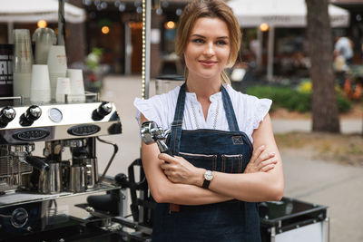 Portrait of young woman using mobile phone