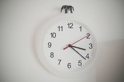 Close-up of clock on wall