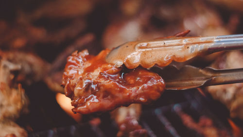 Close-up of meat on barbecue grill