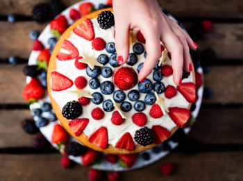 Close-up of hand holding fruit