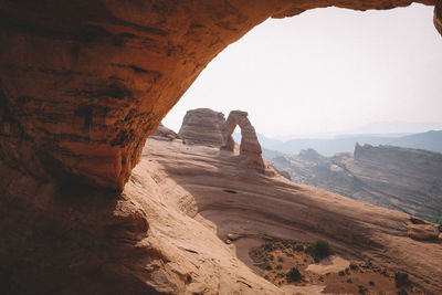 Delicate arch seen in the distance from another archway