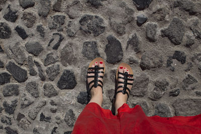 Low section of woman standing on land