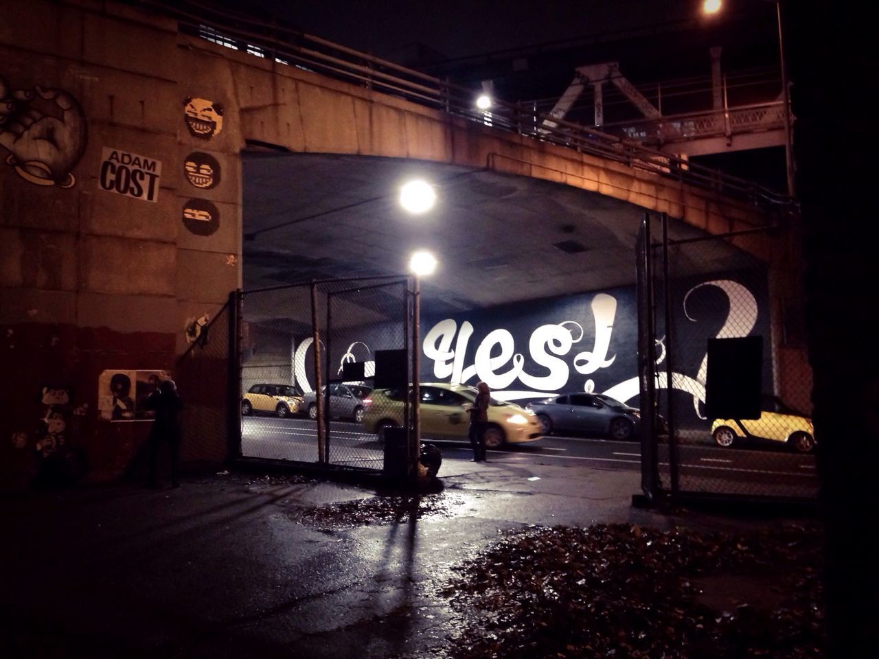 illuminated, night, built structure, architecture, the way forward, lighting equipment, text, empty, street light, indoors, transportation, architectural column, diminishing perspective, no people, street, western script, absence, graffiti, long, light - natural phenomenon