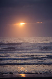 Scenic view of sea against sky at sunset