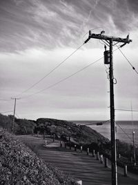 Power lines against sky