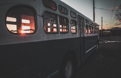 Close-up of bus against sky