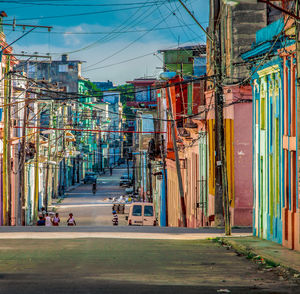 Road amidst buildings in city