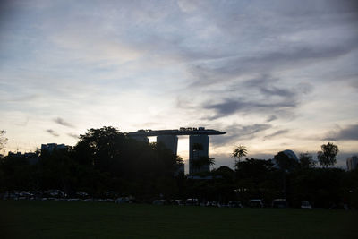 Buildings against cloudy sky