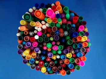 Close-up of colorful pens on table