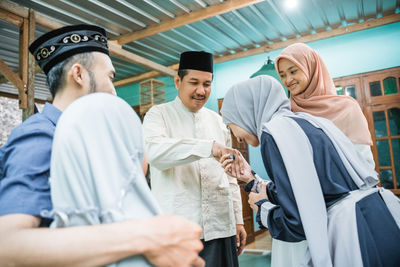 Portrait of smiling couple standing outdoors