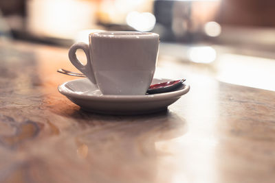 Close-up of coffee cup on table