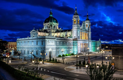 Illuminated building against sky at night