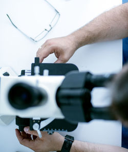 Directly above shot of man using microscope