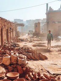 Full length of man standing at war zone