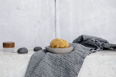 Close-up of stuffed toy on table against wall