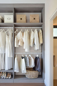 Clothes hanging on shelf at home