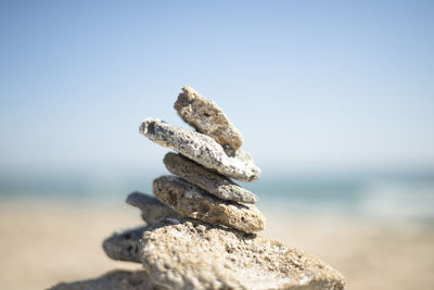 A pyramid of stones on the seashore. cobblestone tower. philosophical themes 