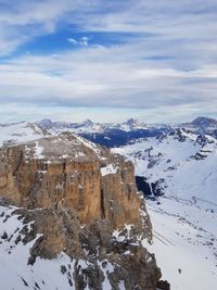 Scenic view of snow covered mountains against sky